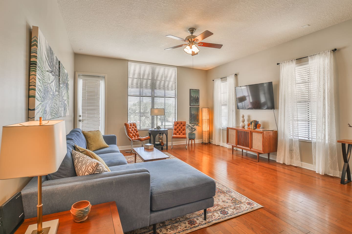 Spacious Urban Perch living room with seating and a small work table